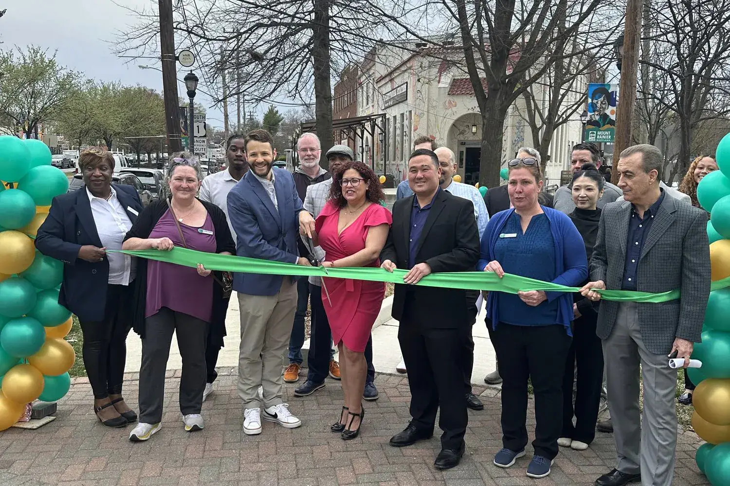 Ribbon cutting ceremony with city officials and residents at Memorial Park in Mount Rainier, Maryland
