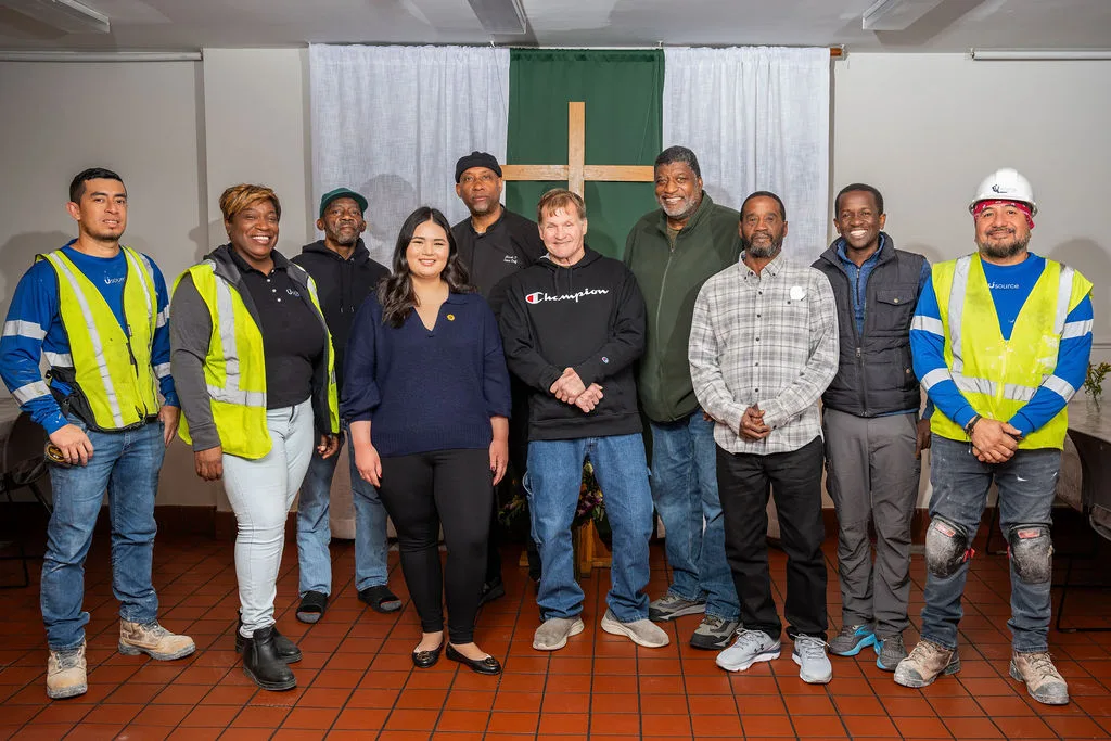 Usource crew with Christ House staff and residents inside the building
