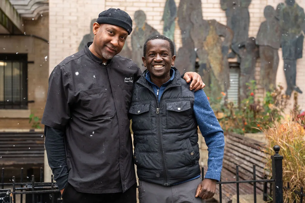 A Christ House chef with a member of the Usource crew
