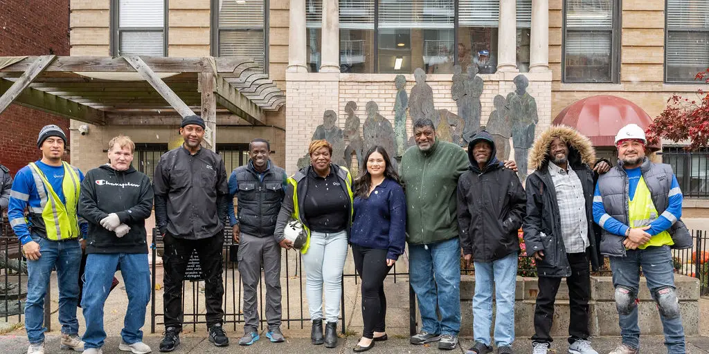 Usource crew with Christ House staff outside the building on Columbia Road