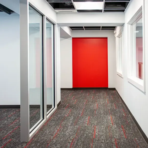 Corridor and glass-partitioned offices at the Festival Center