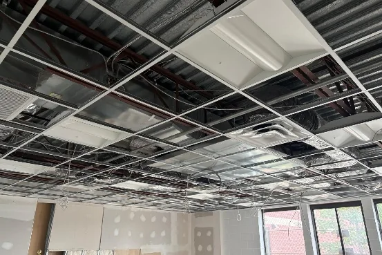 Ceiling grid and lighting going in above a new classroom