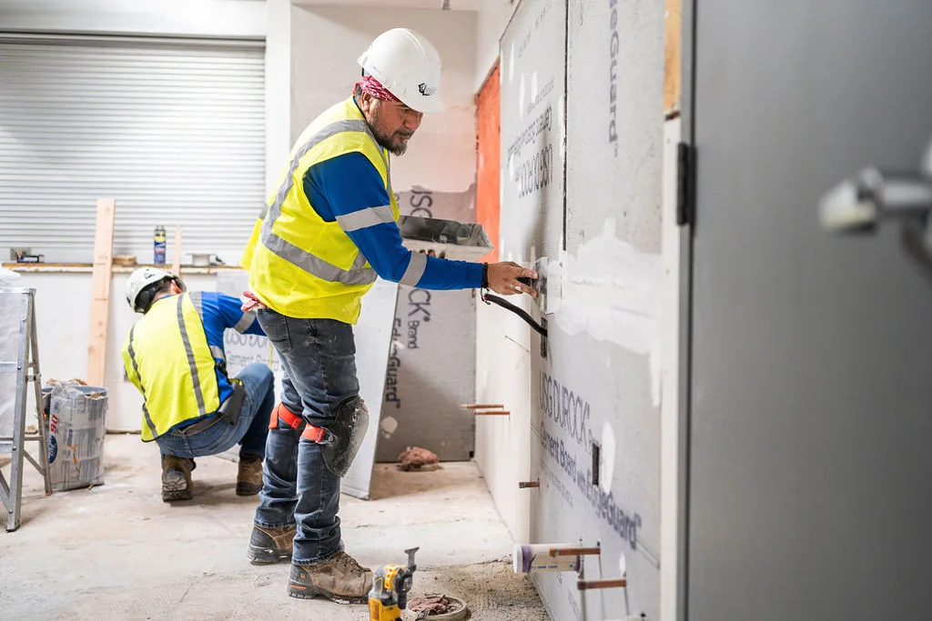 Finishing a new wall ahead of the classroom fit-out