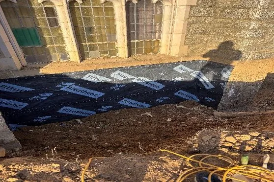 Waterproofing membrane applied to the excavated foundation wall