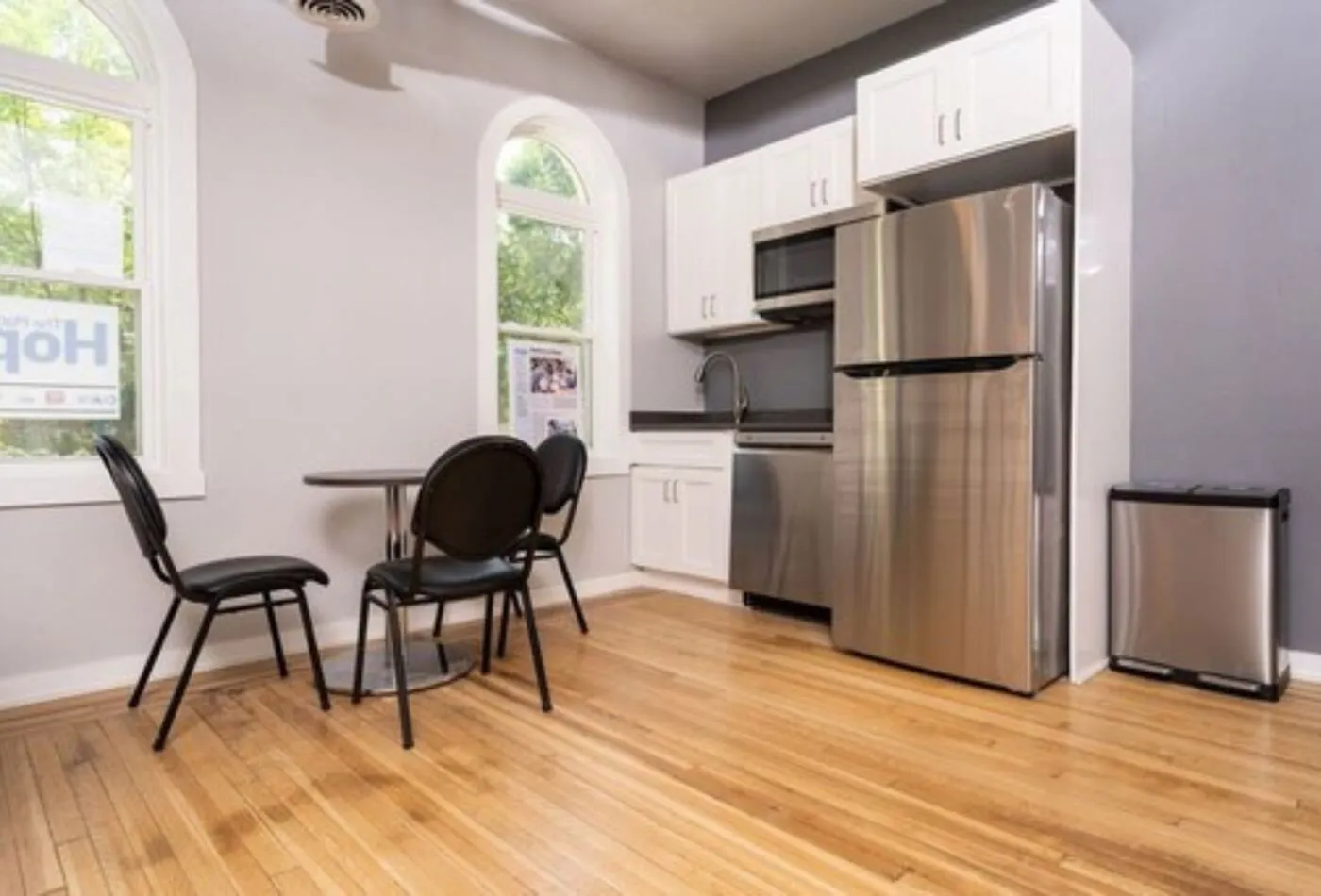 Kitchen and meeting area with the original arched windows